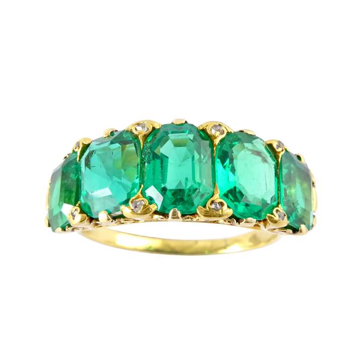 Antique five stone emerald and gold ring, c.1890, with graduated Colombian stones of emerald cut,